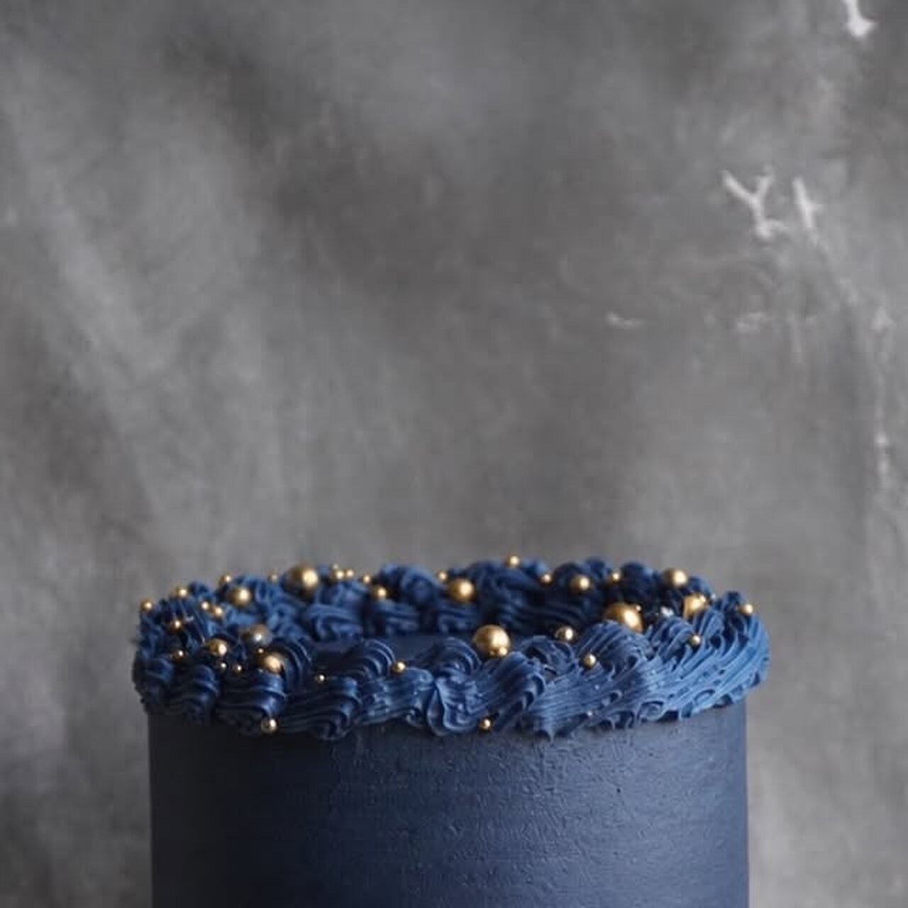 Midnight blue celebration cake with gold pearls by Harshies Bakehouse